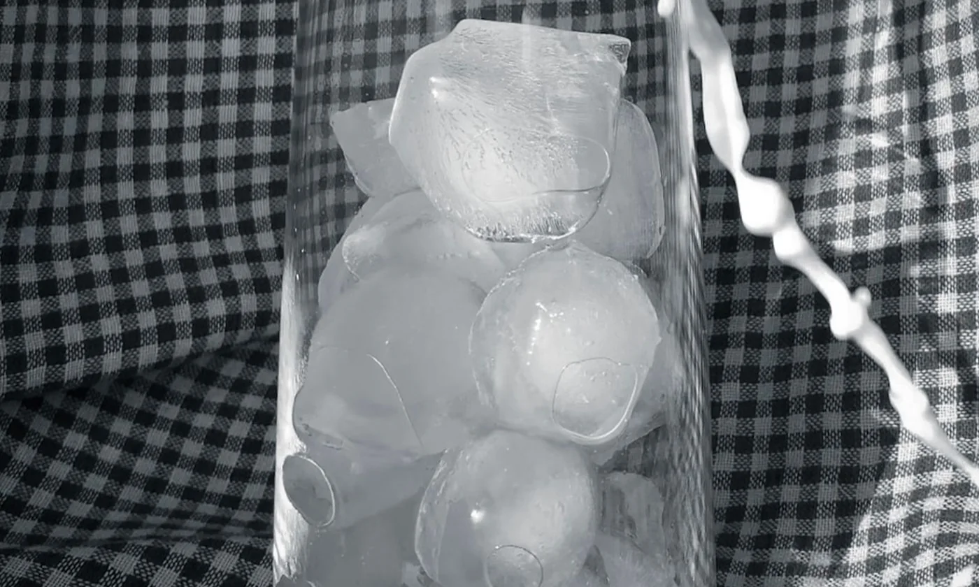 Ice cubes in a clear drinking glass